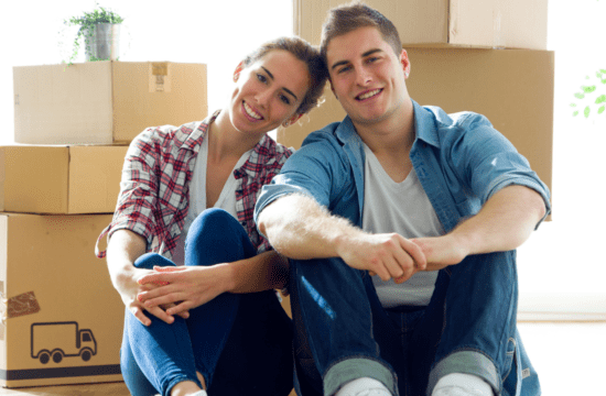 couple in front of boxes