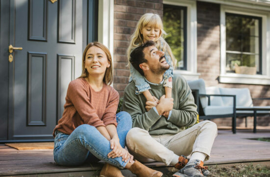 Family in front of their home