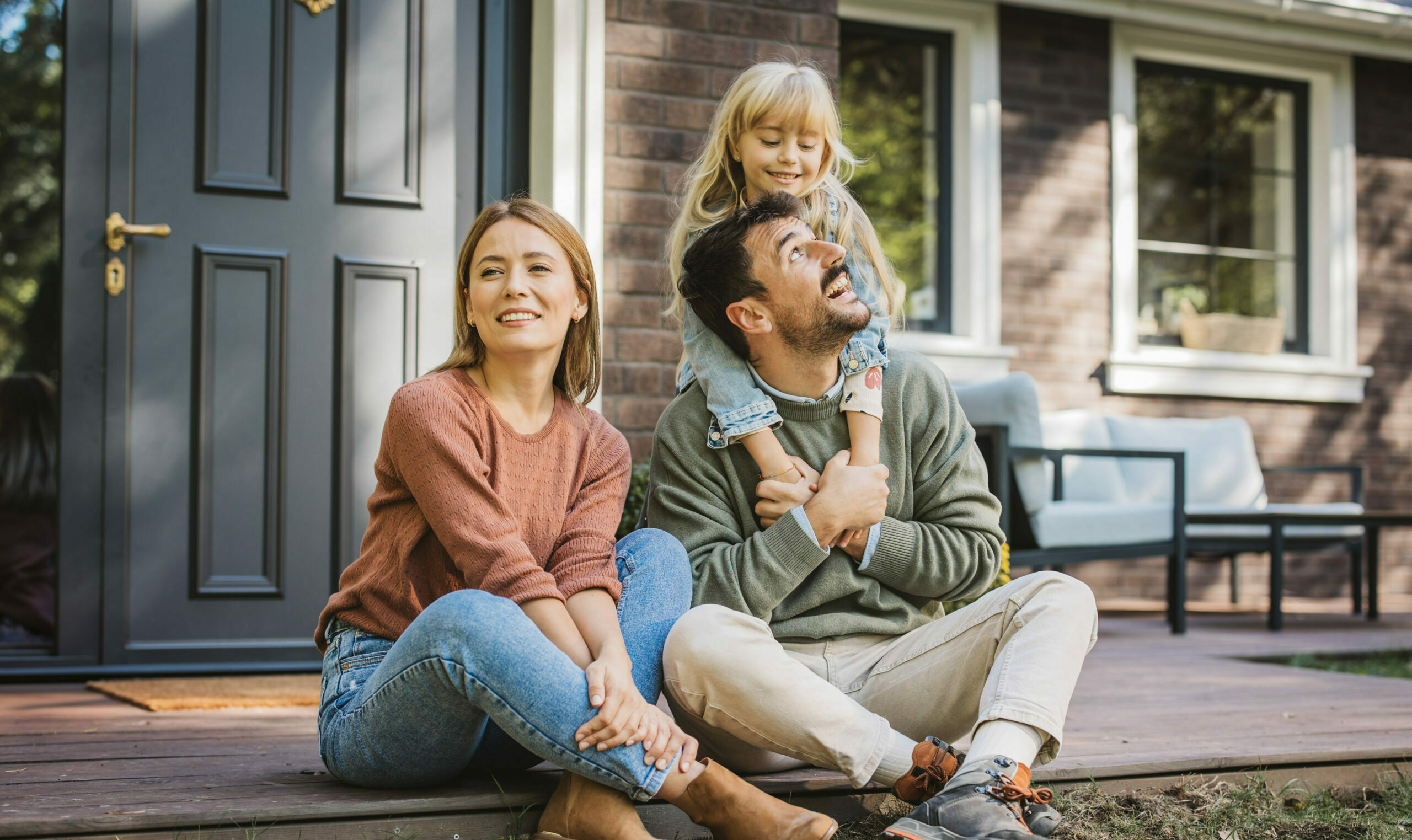 Family in front of their home