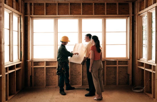 Couple meeting with architect about home addition.